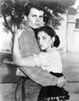 Patrick Wayne and Yvonne Craig