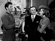 Robert Mitchum, Ricardo Cortez, and Laraine Day