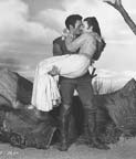 Barbara Rush and Jack Palance