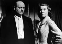 Eric Pohlmann and Lois Maxwell