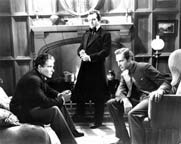 Douglass Montgomery, Claude Rains, and David Manners