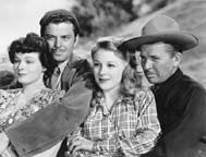 Ruth Hussey, John Carroll, Evelyn Ankers, and Bruce Cabot