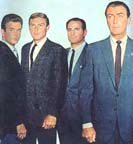 Mark Goddard, Adam West, Tige Andrews, and Robert Taylor